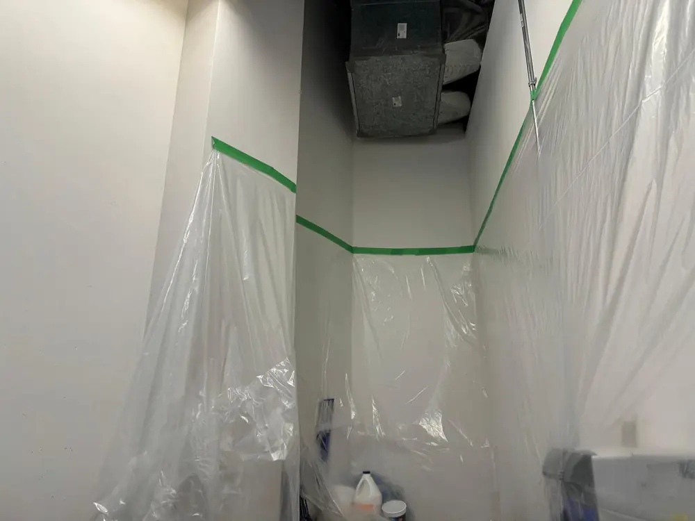 Sealed wall containment installed ahead of interior works