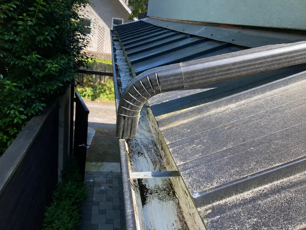 Gutter cleared, flushed and tested. Drag to compare., after